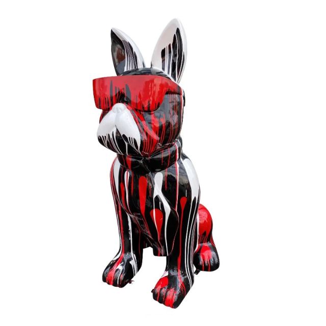 Sculpture sitting dog black with red and white splash with glasses and neck tie
