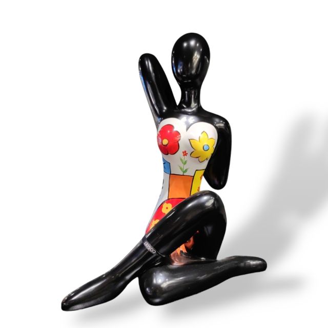 Sculpture yoga lady with flowers