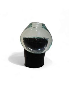 Mouth blown glass on tree plunk- black